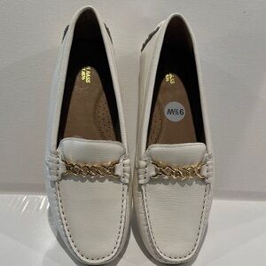 G. H. Bass White Ladies Loafers with Goldtone Chain across the front. Size 9.5